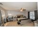Spacious main bedroom with a ceiling fan, dresser, decor and a full length mirror at 1808 Ashton E Dr, St Cloud, FL 34771
