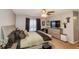 Comfortable bedroom featuring a ceiling fan, closet, and a large window at 1808 Ashton E Dr, St Cloud, FL 34771