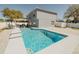 Backyard with a sparkling pool and an outdoor seating area, perfect for entertaining guests at 1808 Ashton E Dr, St Cloud, FL 34771