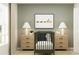 Adorable Bedroom featuring a green crib, animal art, and neutral decor for a soothing and stylish baby room at 2109 Lasso Loop, Eagle Lake, FL 33839