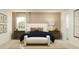 Inviting bedroom featuring a plush bed, matching nightstands, and bright decor for a cozy and stylish space at 2109 Lasso Loop, Eagle Lake, FL 33839