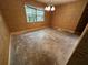 Cozy bedroom features neutral walls, a window for natural light, and no flooring at 3050 Carolina Ave, Lakeland, FL 33803