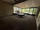 Enclosed porch with carpet and a hot tub at 3050 Carolina Ave, Lakeland, FL 33803