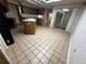 Open concept kitchen features a central island, plenty of cabinet space, and access to the outdoor patio at 3050 Carolina Ave, Lakeland, FL 33803