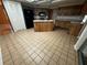 Bright kitchen featuring wood cabinets, a central island, and modern black appliances at 3050 Carolina Ave, Lakeland, FL 33803