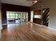 Spacious living room featuring hardwood floors, neutral walls, and sliding glass doors to the patio at 3050 Carolina Ave, Lakeland, FL 33803