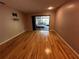 Large bedroom with gleaming hardwood floors and access to screened porch at 3050 Carolina Ave, Lakeland, FL 33803