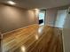 Open and spacious room with hardwood floors, bathroom, and slider to porch at 3050 Carolina Ave, Lakeland, FL 33803