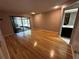 Spacious bedroom with hardwood floors and access to an enclosed patio at 3050 Carolina Ave, Lakeland, FL 33803