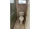 Bathroom features a toilet and enclosed shower with patterned wallpaper at 3050 Carolina Ave, Lakeland, FL 33803