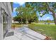 Backyard patio area with seating and a view of the pond, enhancing the property's outdoor living space at 1322 Aguacate Ct, Orlando, FL 32837