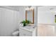 Bathroom with white vanity, decorative mirror, and shower curtain at 1322 Aguacate Ct, Orlando, FL 32837