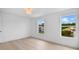 A bedroom with vinyl flooring and windows at 1322 Aguacate Ct, Orlando, FL 32837