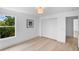 A bedroom with a window, closet, and vinyl flooring at 1322 Aguacate Ct, Orlando, FL 32837