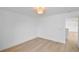 An empty bedroom with vinyl flooring and a ceiling light at 1322 Aguacate Ct, Orlando, FL 32837