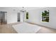 Bright bedroom with two exterior view windows and a modern chandelier light fixture at 1322 Aguacate Ct, Orlando, FL 32837