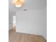 Bright bedroom with modern light fixture and light wood floor at 1322 Aguacate Ct, Orlando, FL 32837
