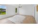 Bright bedroom with exterior view window and light wood floors at 1322 Aguacate Ct, Orlando, FL 32837