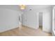 A bright bedroom with vinyl flooring and walk-in closet access at 1322 Aguacate Ct, Orlando, FL 32837