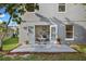 Backyard patio with outdoor seating area and landscaped backyard at 1322 Aguacate Ct, Orlando, FL 32837