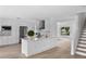 Bright, open kitchen featuring white cabinets, stainless steel appliances, and an island with modern finishes at 1322 Aguacate Ct, Orlando, FL 32837