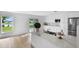 Kitchen island with quartz countertop, stainless appliances, and view of the backyard with pond at 1322 Aguacate Ct, Orlando, FL 32837
