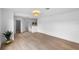 Bright living room with light wood floors and views to an ensuite bathroom at 1322 Aguacate Ct, Orlando, FL 32837