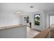 Open loft area featuring two large windows with neighborhood views and light wood floors at 1322 Aguacate Ct, Orlando, FL 32837