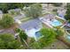 A high angle view reveals a beautiful residence in an established neighborhood with an inviting pool at 14464 Sw 34Th Terrace Rd, Ocala, FL 34473