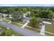 Aerial view of a house in a lovely neighborhood with a large pool and lush greenery at 14464 Sw 34Th Terrace Rd, Ocala, FL 34473
