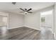 Clean bedroom with gray flooring, neutral walls, and a ceiling fan at 14464 Sw 34Th Terrace Rd, Ocala, FL 34473