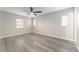 This bedroom features a ceiling fan and several windows for natural light at 14464 Sw 34Th Terrace Rd, Ocala, FL 34473