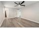 This is a bedroom with gray flooring and a ceiling fan; the bathroom is visible at 14464 Sw 34Th Terrace Rd, Ocala, FL 34473