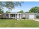 Charming one-story home with a well-manicured lawn and attached one-car garage at 14464 Sw 34Th Terrace Rd, Ocala, FL 34473