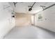 Spacious garage featuring a light gray floor and ample room for parking and storage solutions at 14464 Sw 34Th Terrace Rd, Ocala, FL 34473