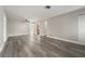 A spacious living room with a ceiling fan and modern gray flooring at 14464 Sw 34Th Terrace Rd, Ocala, FL 34473