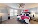 Serene main bedroom suite with abundant natural light and elegant decor at 1888 Bright Sky Dr, Kissimmee, FL 34744