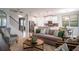 Open-concept living room with kitchen view, modern decor and beautiful furnishings at 2507 Peace Of Mind Ave, Kissimmee, FL 34744
