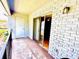 Cozy balcony with brick facade, railing, sliding glass doors, and outdoor lighting at 296 Lewfield Cir, Winter Park, FL 32792
