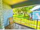 Relax on this charming balcony with views of lush landscaping and community green space at 296 Lewfield Cir, Winter Park, FL 32792