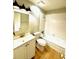 Bright bathroom with white vanity, updated faucet and shower/tub combo at 296 Lewfield Cir, Winter Park, FL 32792