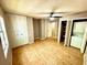 Bedroom with wood floors, neutral walls, double closets, and a washer/dryer at 296 Lewfield Cir, Winter Park, FL 32792