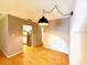 Dining area featuring wood floors and a pendant light at 296 Lewfield Cir, Winter Park, FL 32792