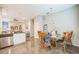 Open dining area features modern lighting and easy access to the living room at 3184 Whispering Trails Ave, Winter Haven, FL 33884