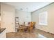 Bright dining area features modern lighting and a window at 3184 Whispering Trails Ave, Winter Haven, FL 33884