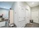 Hallway with multiple doors for easy access to rooms at 3184 Whispering Trails Ave, Winter Haven, FL 33884