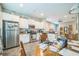 Bright kitchen features stainless steel appliances and white cabinetry at 3184 Whispering Trails Ave, Winter Haven, FL 33884