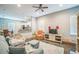 Open living room featuring modern finishes, comfortable seating, and seamless flow into the kitchen area at 3184 Whispering Trails Ave, Winter Haven, FL 33884