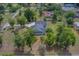 High aerial shot showcases this home and its tree-lined property in a quiet neighborhood at 4004 Se 47Th Pl, Ocala, FL 34480