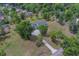 Panoramic aerial view of a home with an extended driveway and a large tree-lined lot at 4004 Se 47Th Pl, Ocala, FL 34480
